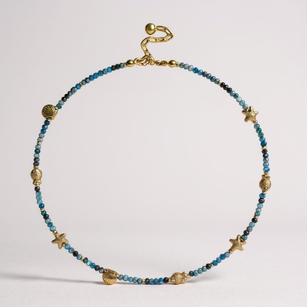 Apatite gemstone necklace with gold-plated seashell, starfish, and fish charms