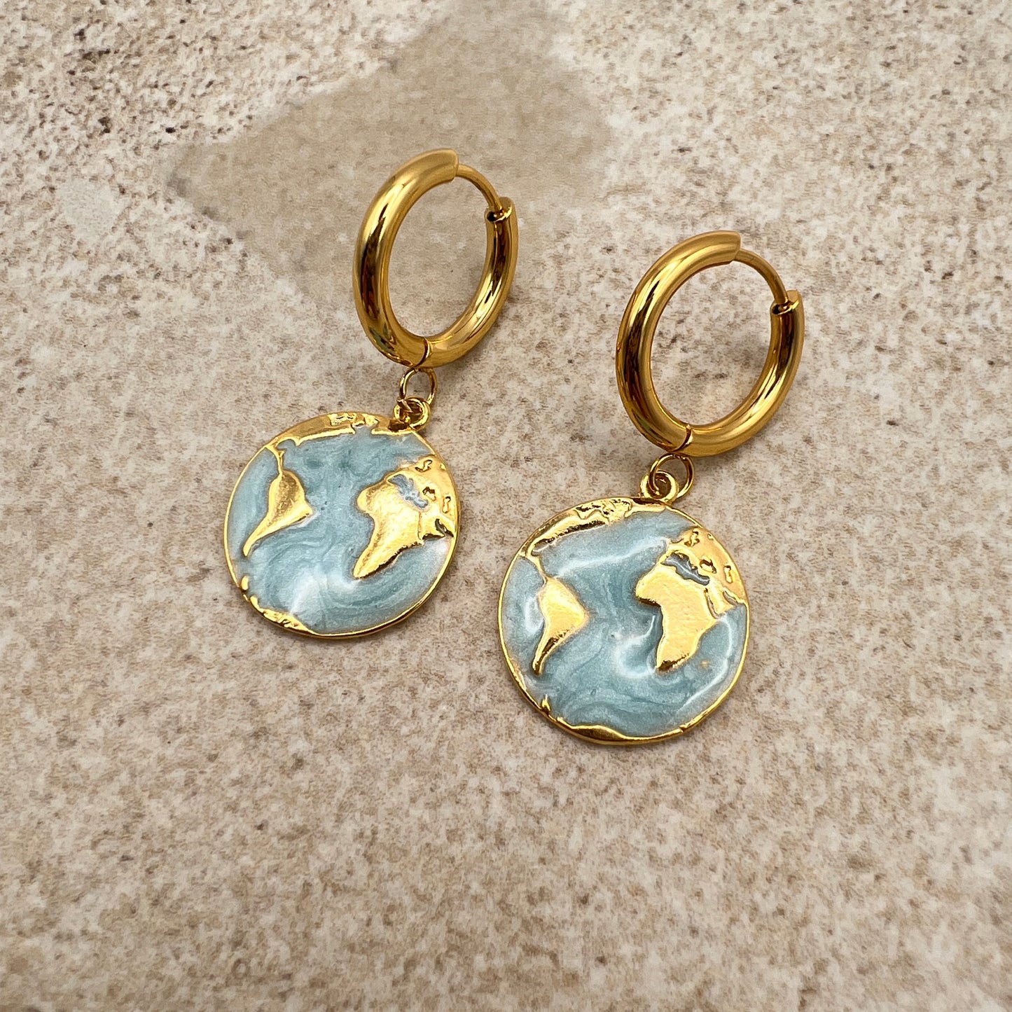 Gold-plated hoop earrings with turquoise enamel globe charm