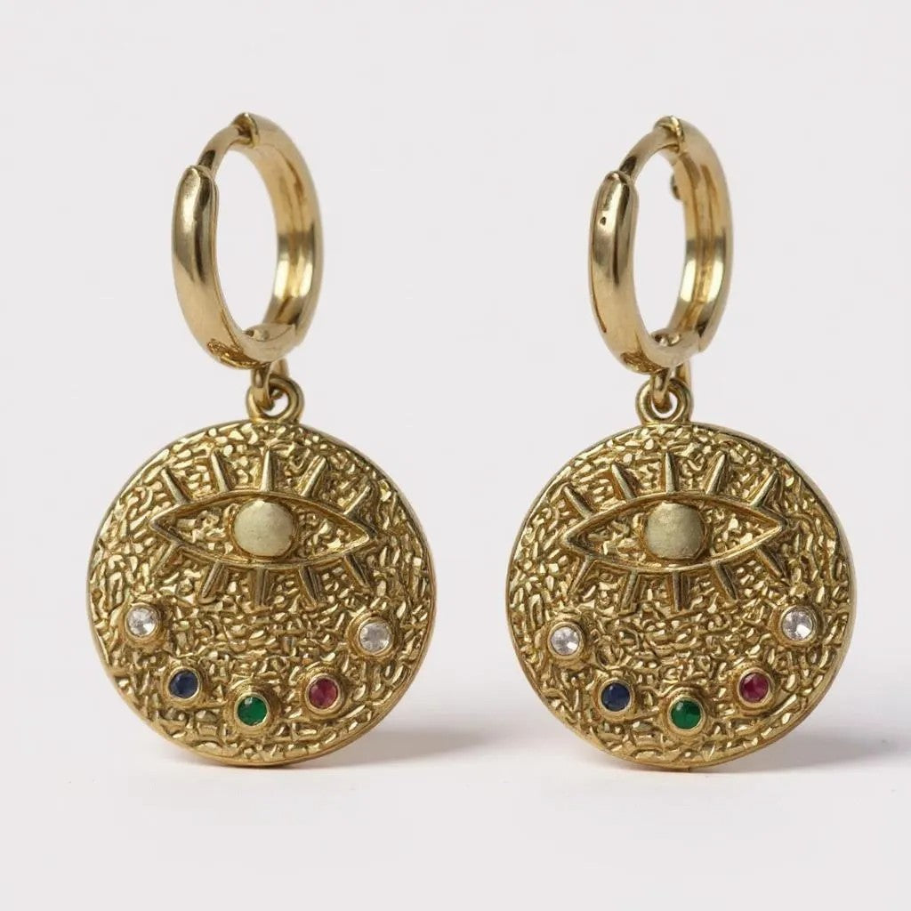 Gold hoop earrings with textured medallion, evil eye, and multicolor stones