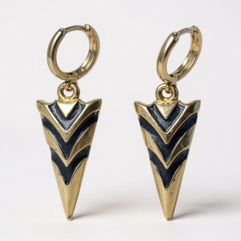 Gold arrowhead hoop earrings with black enamel chevron design