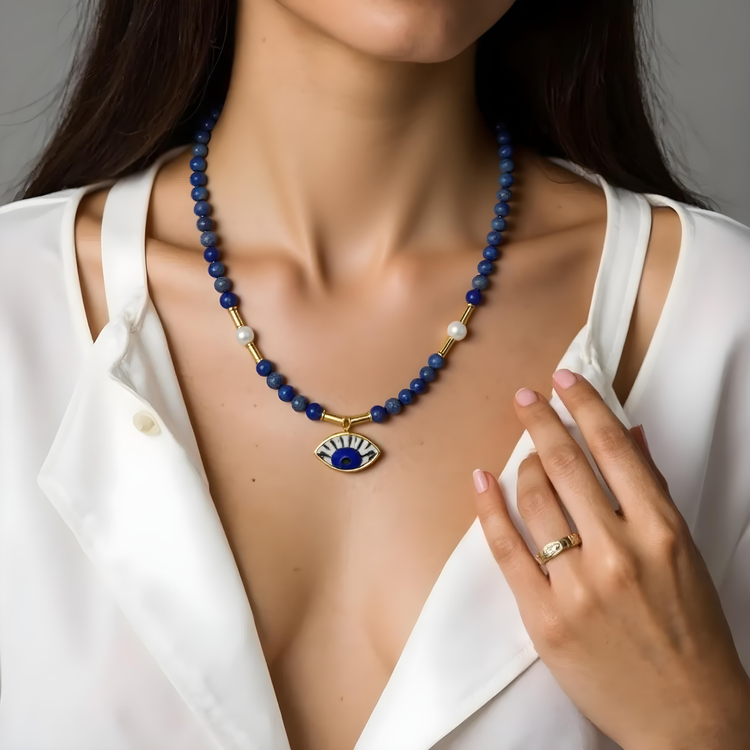 Handcrafted necklace with natural stones and gold-plated charms inspired by Mediterranean design