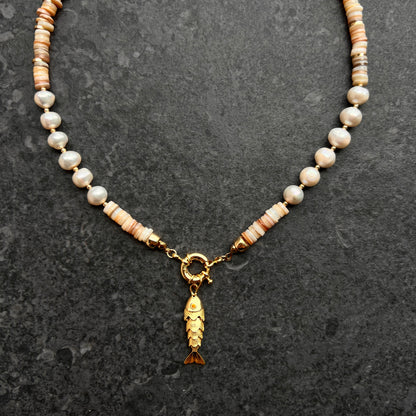 Mother-of-pearl and freshwater pearl necklace with a gold-plated 3D fish charm and amber zircon eyes