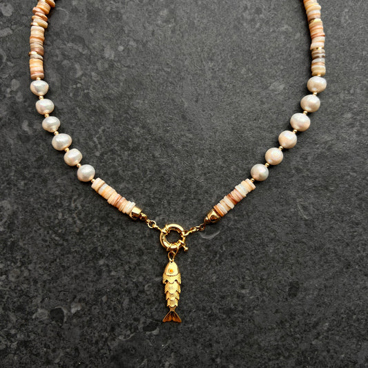 Mother-of-pearl and freshwater pearl necklace with a gold-plated 3D fish charm and amber zircon eyes