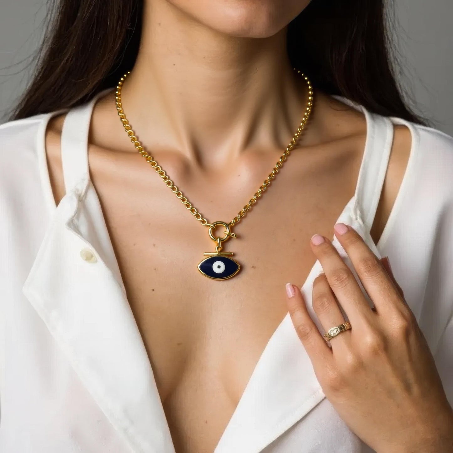 Chunky gold chain necklace with navy enamel evil-eye pendant