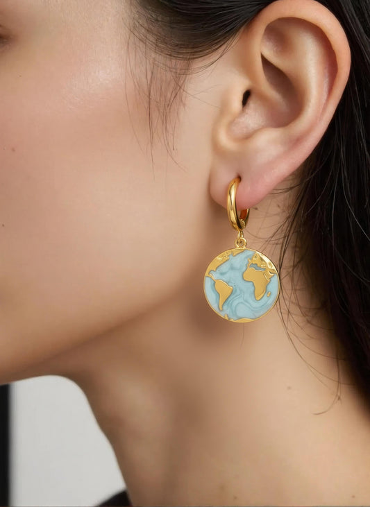 Gold-plated hoop earrings with turquoise enamel globe charm