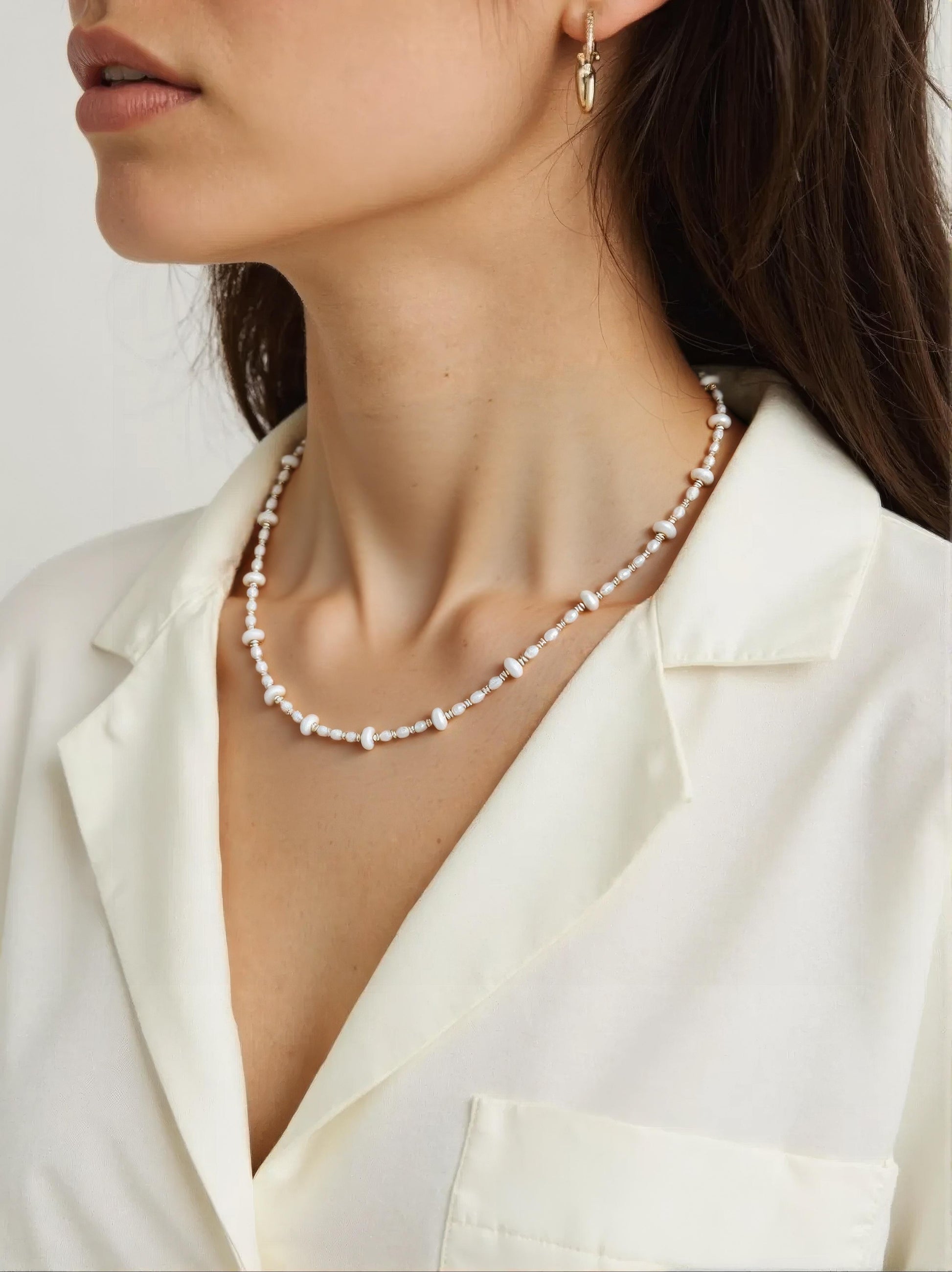 Delicate freshwater pearl necklace with gold-plated accents in a minimalist design