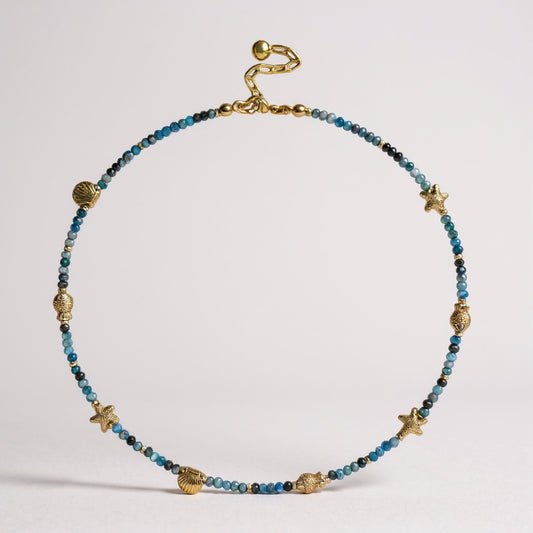 Apatite gemstone necklace with gold-plated seashell, starfish, and fish charms