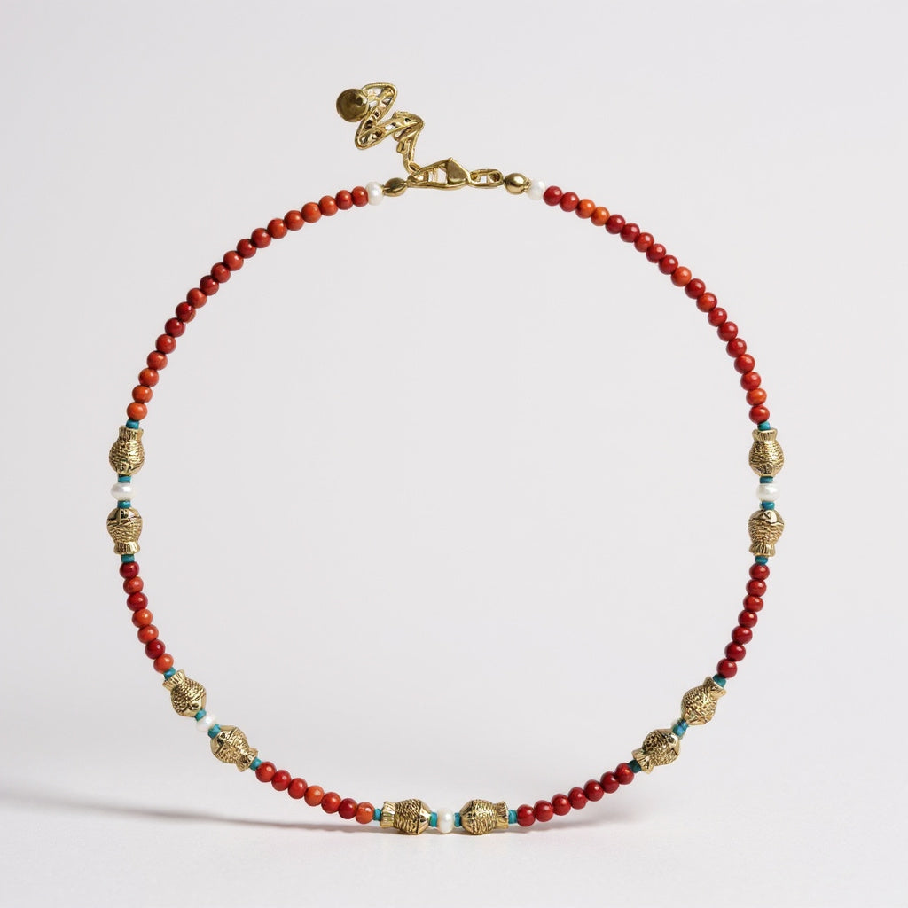 Coral and freshwater pearl necklace with gold-plated fish charms
