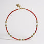Coral and freshwater pearl necklace with gold-plated fish charms