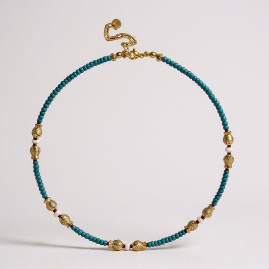 Turquoise and freshwater pearl necklace with gold-plated fish charms and red coral accents