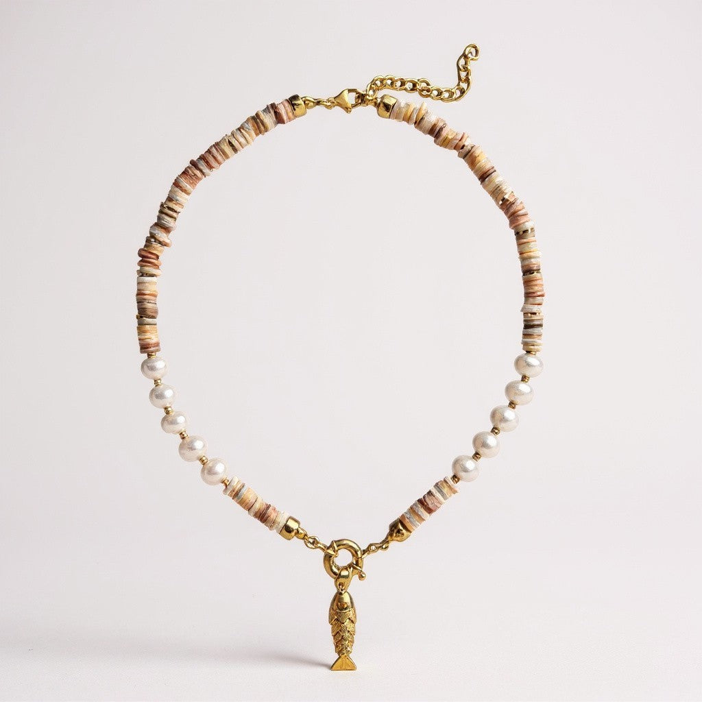 Mother-of-pearl and freshwater pearl necklace with a gold-plated 3D fish charm and amber zircon eyes