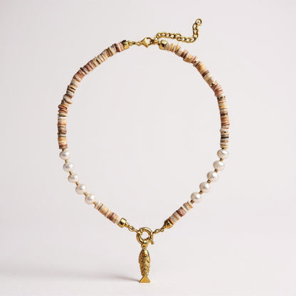 Mother-of-pearl and freshwater pearl necklace with a gold-plated 3D fish charm and amber zircon eyes
