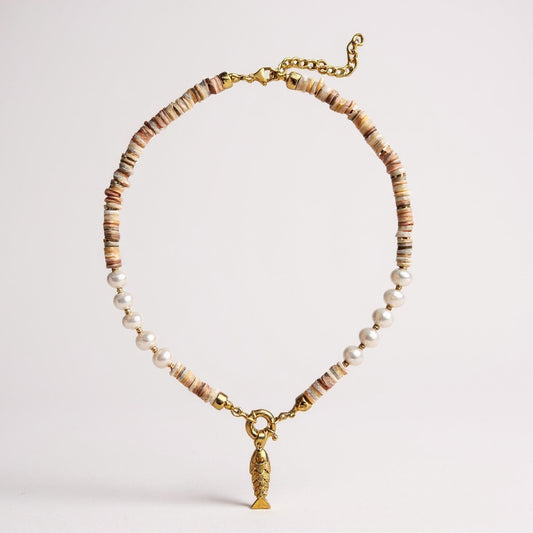 Mother-of-pearl and freshwater pearl necklace with a gold-plated 3D fish charm and amber zircon eyes