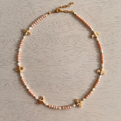 Pink crystal and freshwater pearl necklace with gold-plated bee charms