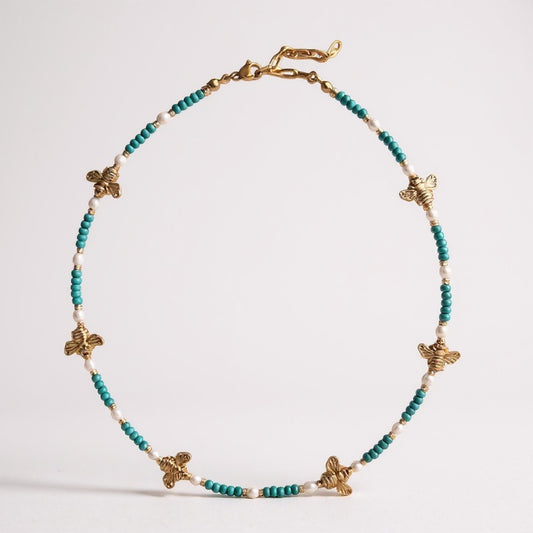 Turquoise bead and freshwater pearl necklace with gold-plated bee charms