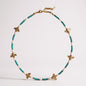 Turquoise bead and freshwater pearl necklace with gold-plated bee charms