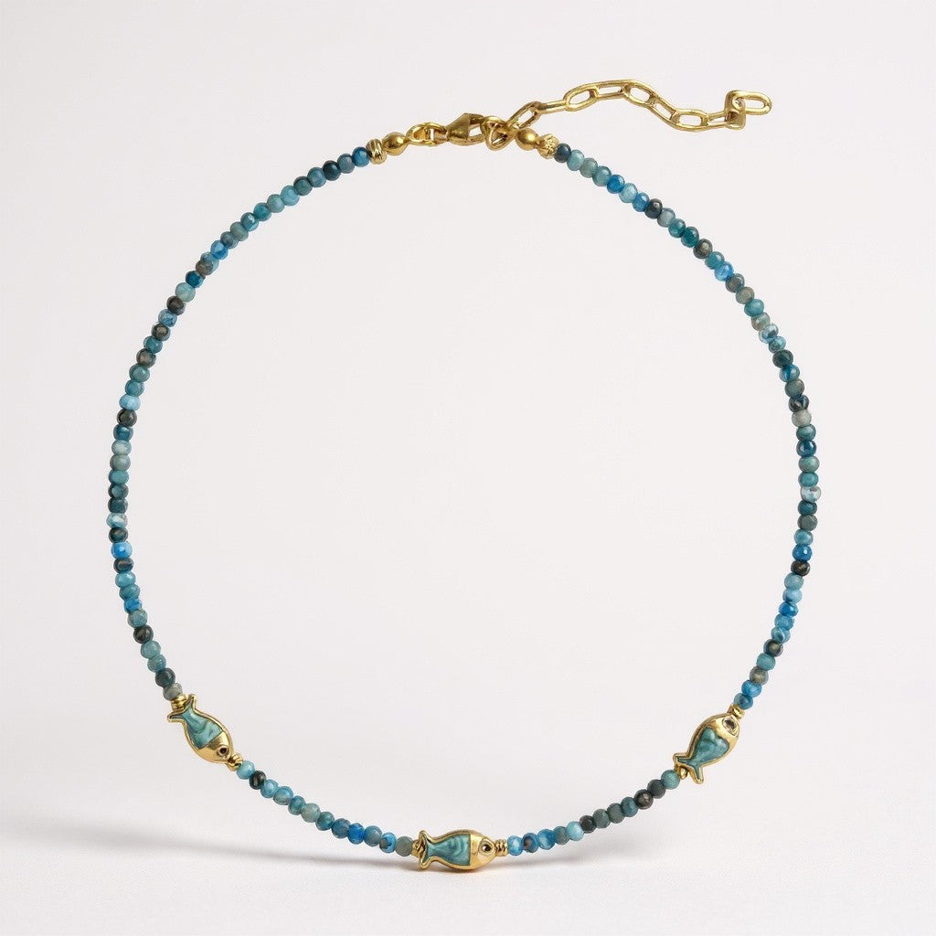 Apatite beaded necklace with three gold-plated mother-of-pearl fish charms
