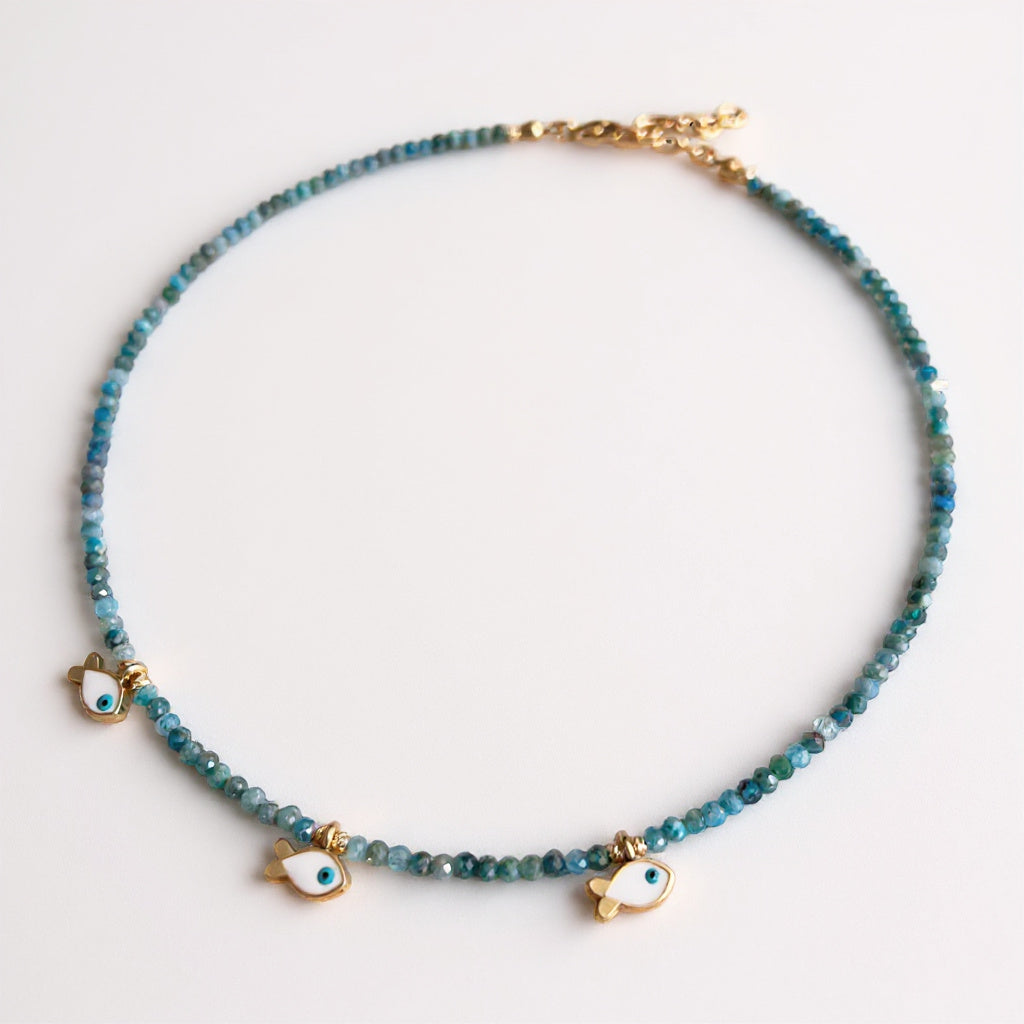 Apatite necklace with three gold-plated fish charms and eye motif
