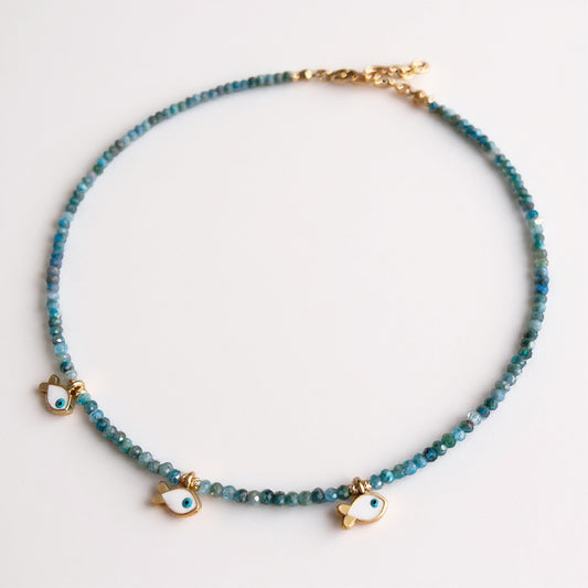 Apatite necklace with three gold-plated fish charms and eye motif