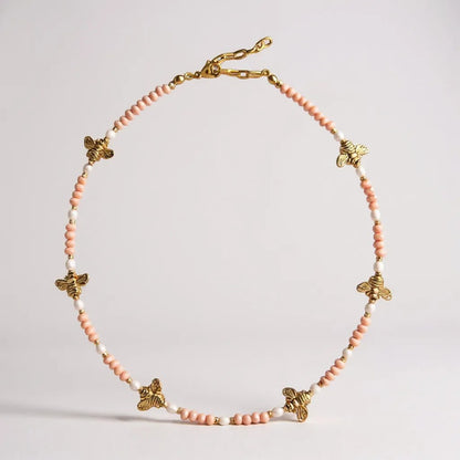 Pink crystal and freshwater pearl necklace with gold-plated bee charms