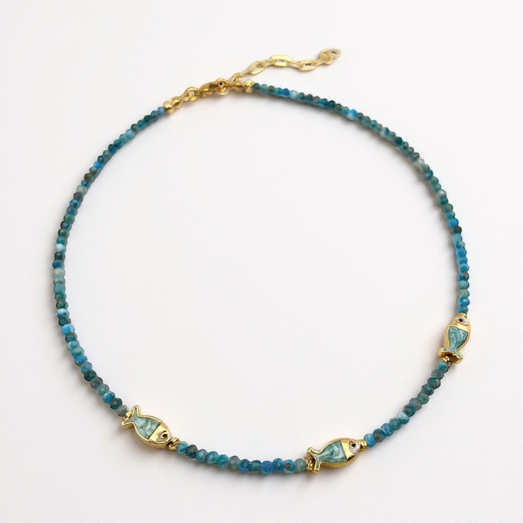 Apatite beaded necklace with three gold-plated mother-of-pearl fish charms