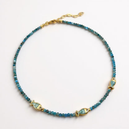 Apatite beaded necklace with three gold-plated mother-of-pearl fish charms