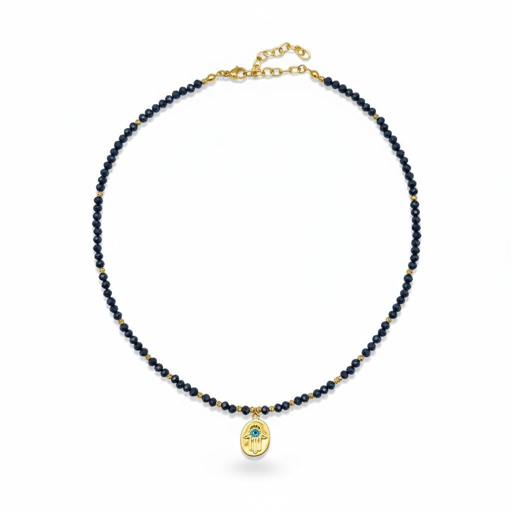 Navy crystal necklace with gold-plated Hamsa charm and blue evil eye accent
