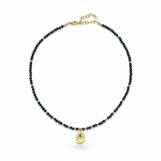 Navy crystal necklace with gold-plated Hamsa charm and blue evil eye accent