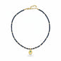 Navy crystal necklace with gold-plated Hamsa charm and blue evil eye accent