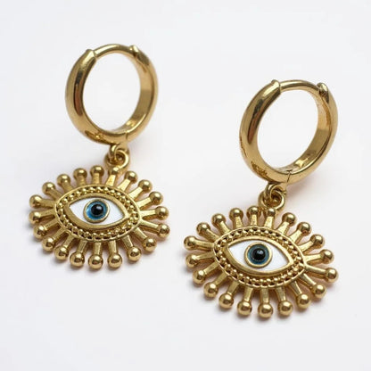 Gold-plated hoop earrings with sunburst blue evil eye pendant