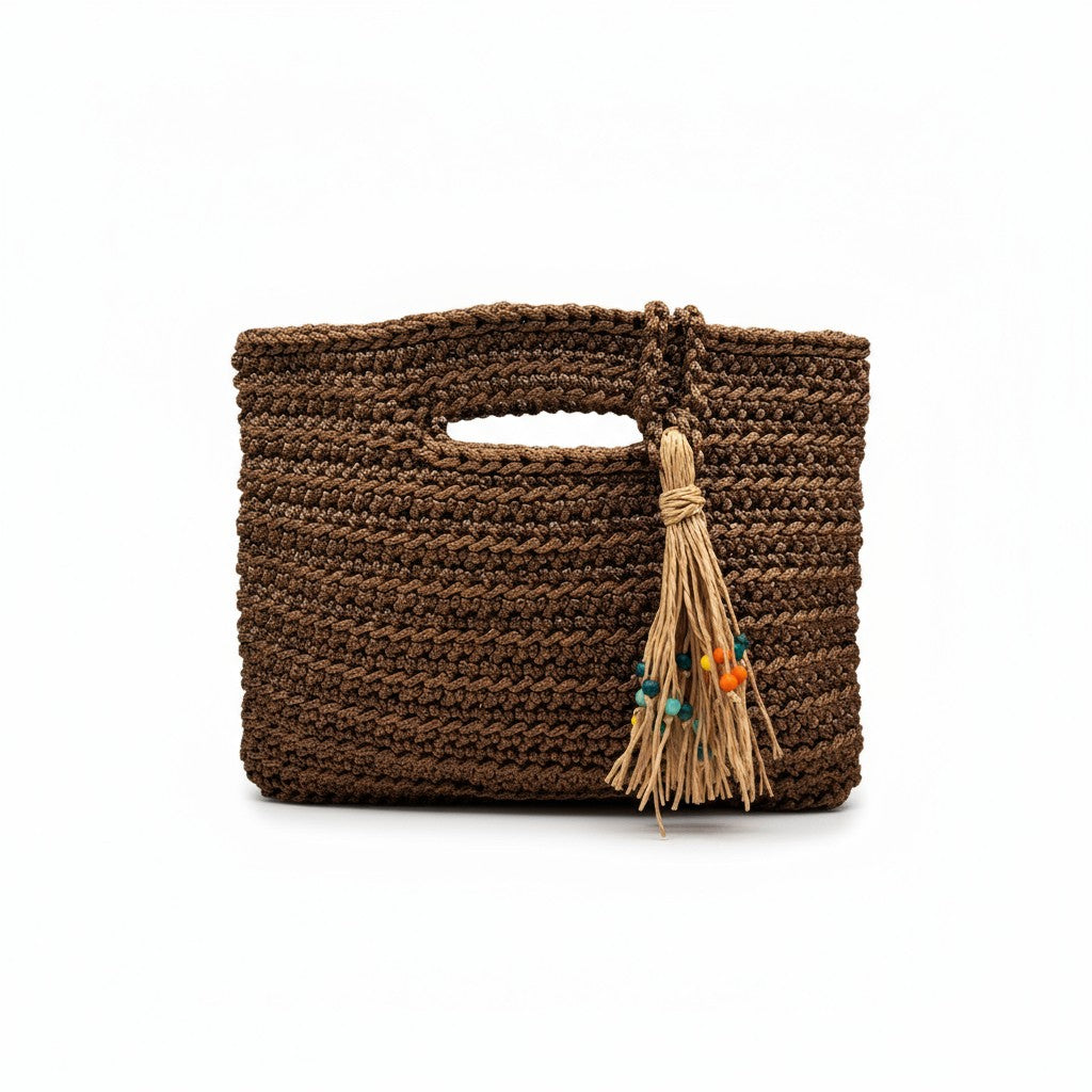 Handcrafted Porto Terra Bag in chocolate brown with straw tassel charm