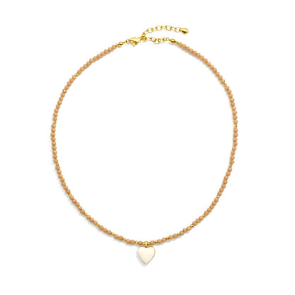 Nude-peach crystal necklace with gold-plated heart charm