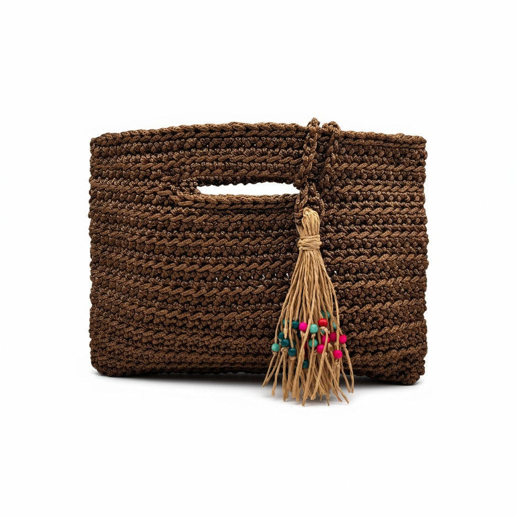 Handcrafted Porto Terra Bag in chocolate brown with straw tassel charm