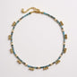 Apatite and freshwater pearl necklace with gold-plated drop charms in ocean-blue tones