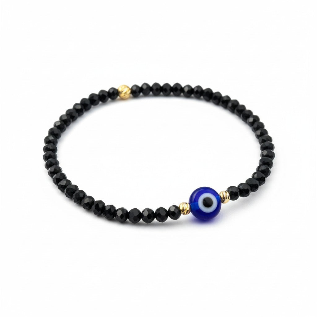 Black crystal beaded bracelet with deep-blue evil eye charm on white background