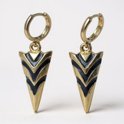Gold arrowhead hoop earrings with black enamel chevron design
