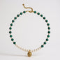 Malachite and freshwater pearl necklace with gold coin pendant